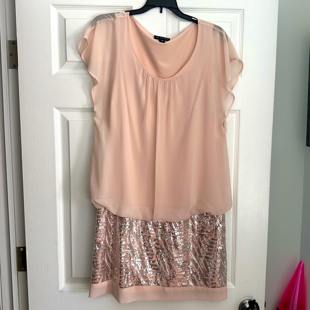 Sleeveless sequined mini dress.